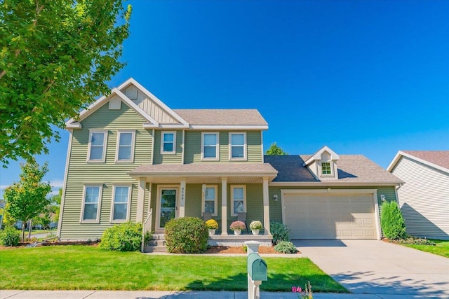 view of front of house featuring a garage, covered porch, and a front lawn