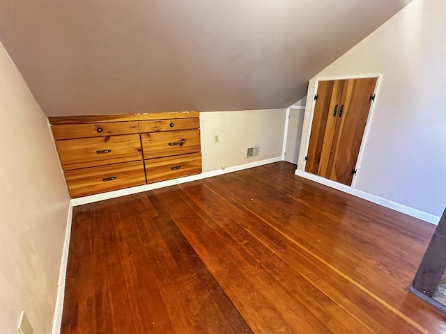 bonus room with lofted ceiling and hardwood / wood-style flooring