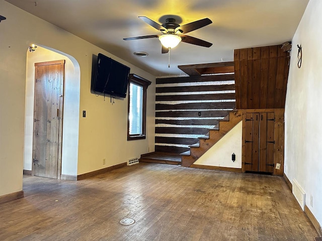 interior space with ceiling fan and hardwood / wood-style flooring