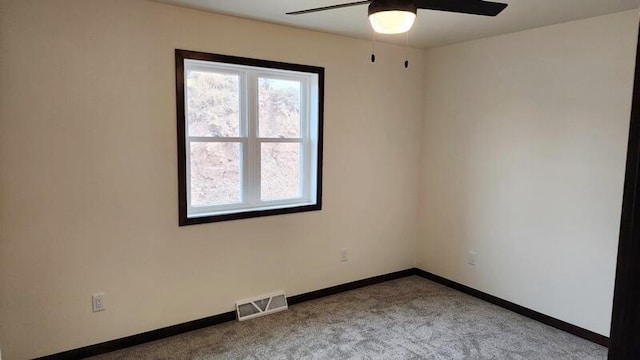 carpeted empty room with ceiling fan