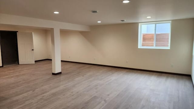 basement featuring light hardwood / wood-style flooring