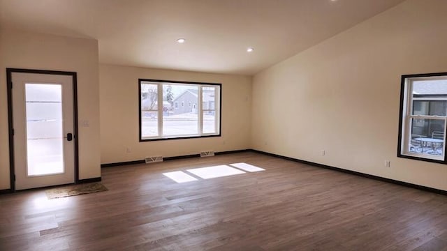 unfurnished room with hardwood / wood-style floors