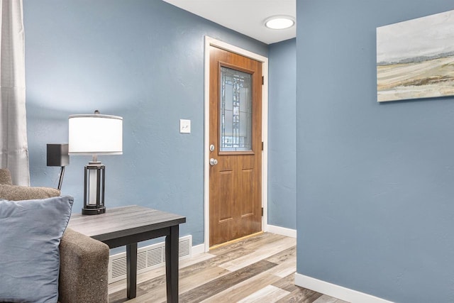 foyer featuring light hardwood / wood-style flooring