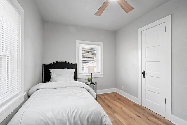 bedroom with ceiling fan and light hardwood / wood-style flooring