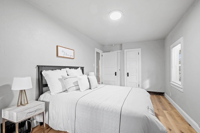 bedroom with wood-type flooring