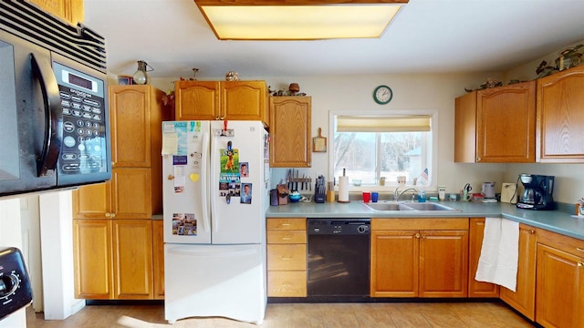 kitchen with sink and black appliances