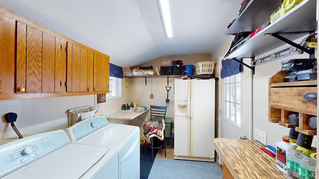 laundry room featuring cabinets and separate washer and dryer