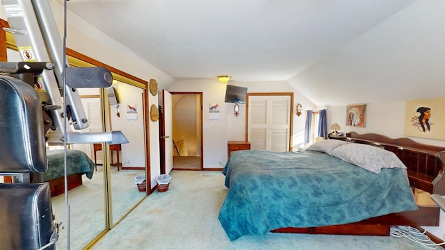 carpeted bedroom featuring vaulted ceiling