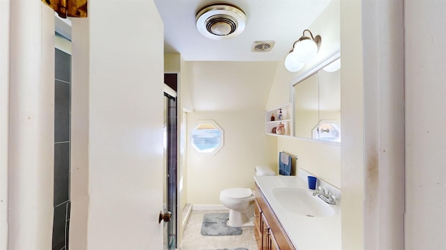 bathroom featuring walk in shower, vanity, and toilet