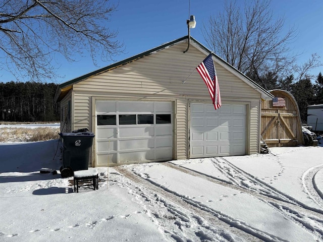 view of snow covered garage