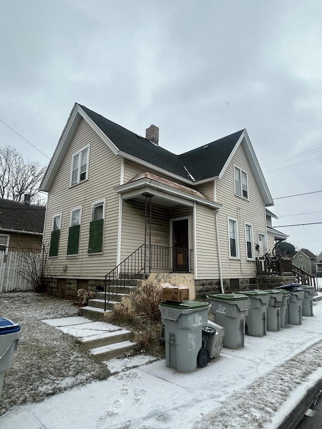 view of snow covered house