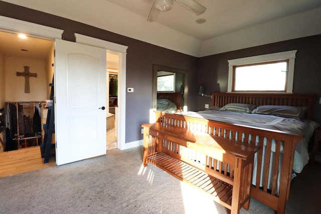 bedroom featuring light colored carpet and ceiling fan