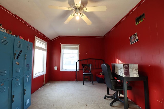 carpeted office space with lofted ceiling, ceiling fan, and ornamental molding