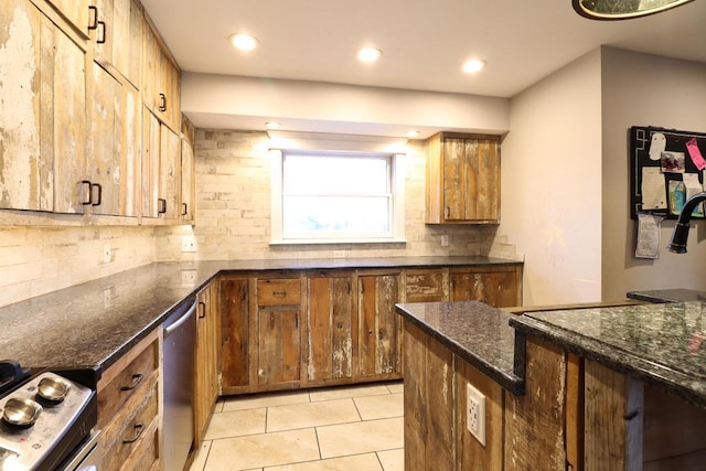 kitchen with stainless steel appliances, dark stone countertops, backsplash, and light tile patterned flooring