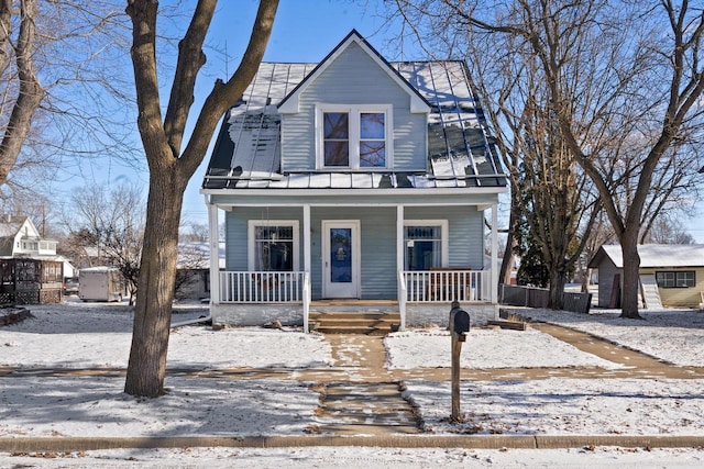 view of front property featuring covered porch