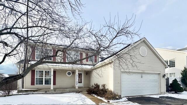 front of property with a garage