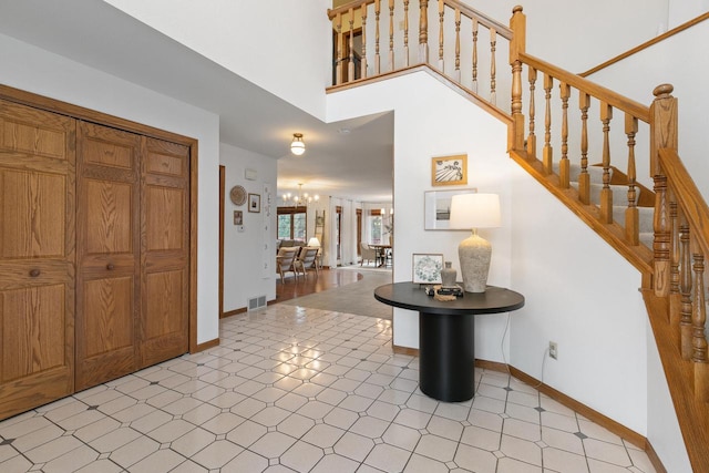 foyer entrance featuring a chandelier