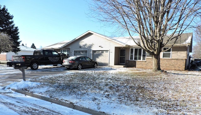 single story home with a garage