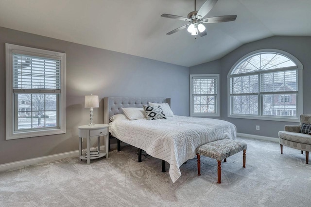 bedroom featuring lofted ceiling, light carpet, and ceiling fan