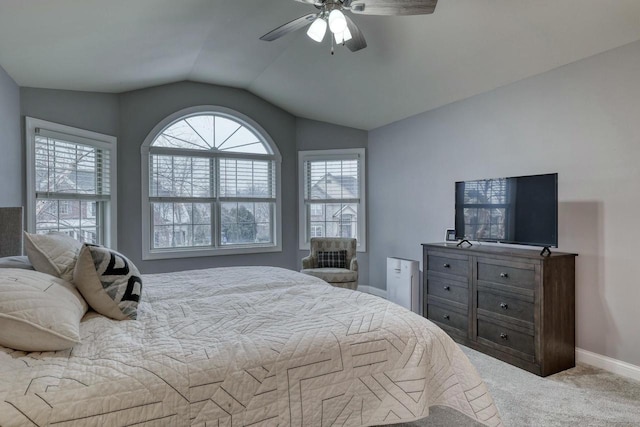 carpeted bedroom with ceiling fan and lofted ceiling