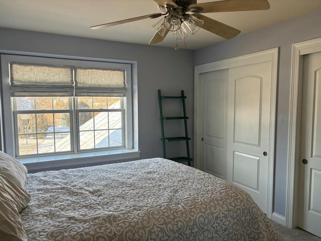 bedroom featuring ceiling fan, carpet flooring, and a closet