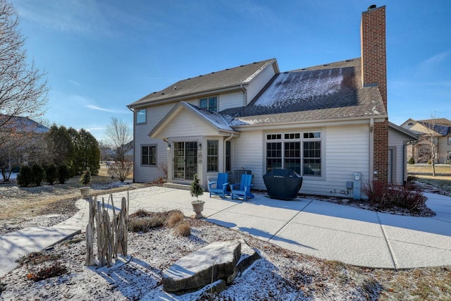 back of property featuring a patio area