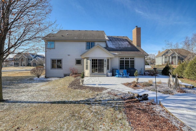 rear view of property featuring a patio area