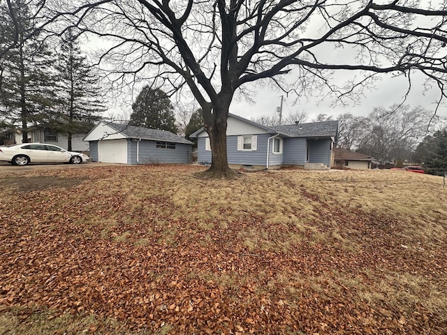 ranch-style house featuring an outbuilding