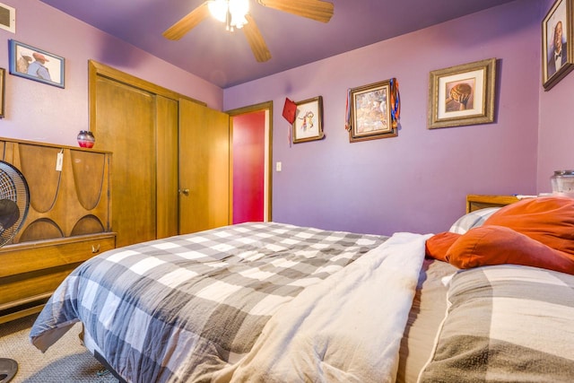 bedroom featuring ceiling fan and a closet