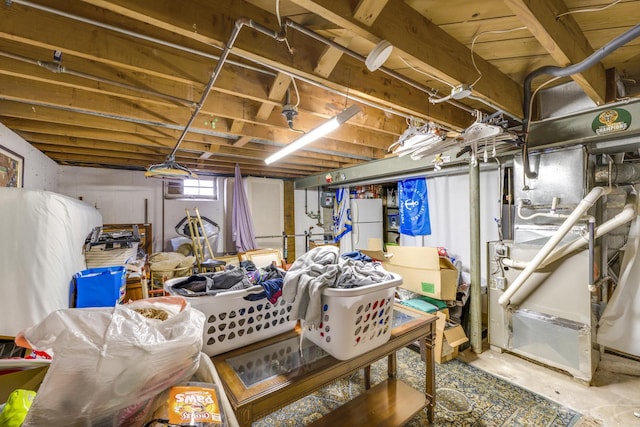 basement featuring white fridge