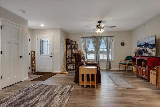 sitting room featuring ceiling fan and light hardwood / wood-style flooring