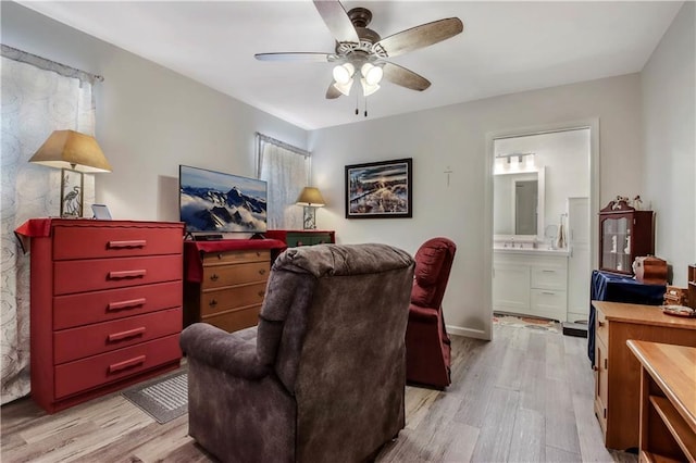 sitting room featuring ceiling fan and light hardwood / wood-style flooring