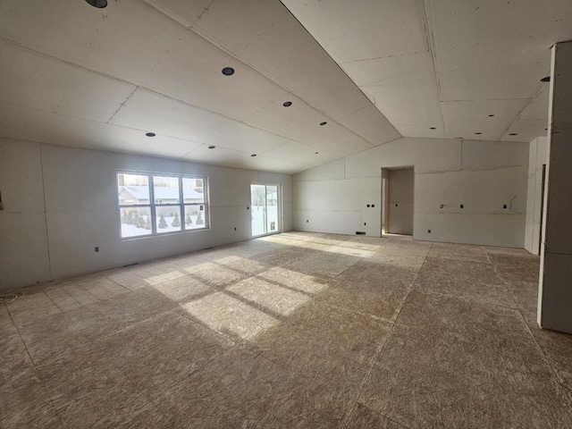 empty room with lofted ceiling