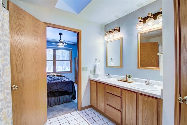 bathroom featuring vanity, tile patterned flooring, and ceiling fan