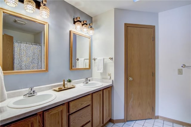 bathroom featuring vanity and tile patterned flooring