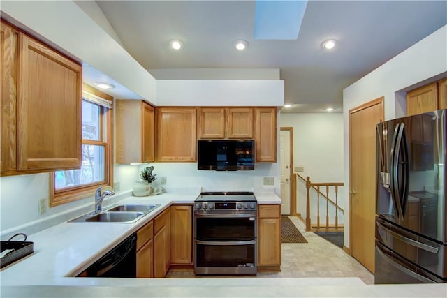 kitchen with sink and black appliances