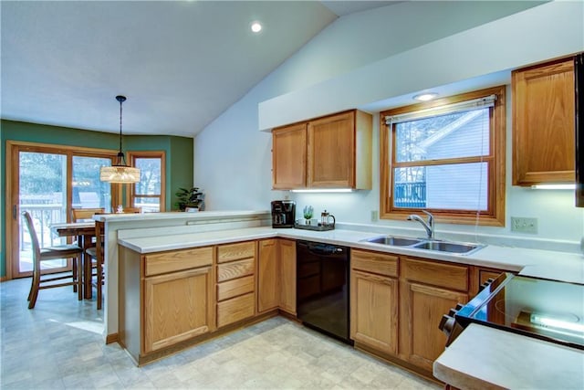 kitchen featuring sink, vaulted ceiling, dishwasher, kitchen peninsula, and pendant lighting