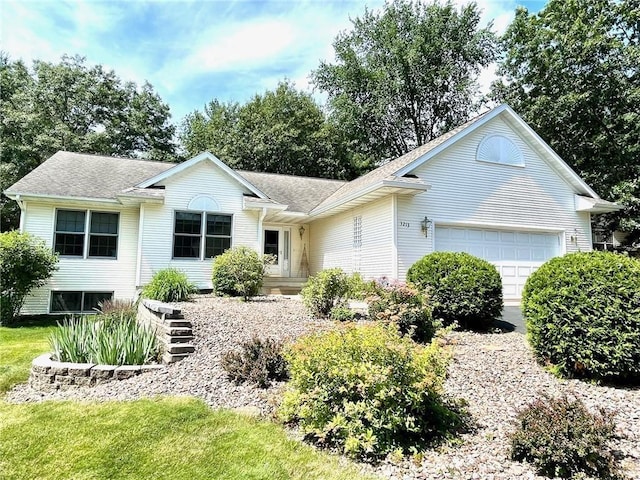 single story home featuring a garage