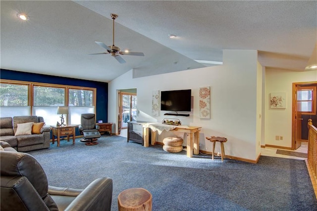 living room with ceiling fan, vaulted ceiling, and carpet