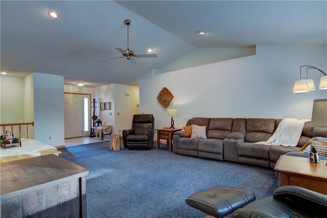 living room with ceiling fan, vaulted ceiling, and carpet