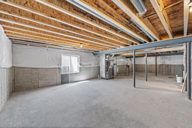 basement with heating unit and gas water heater