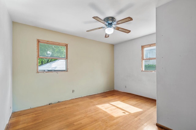 empty room featuring light wood-type flooring and ceiling fan