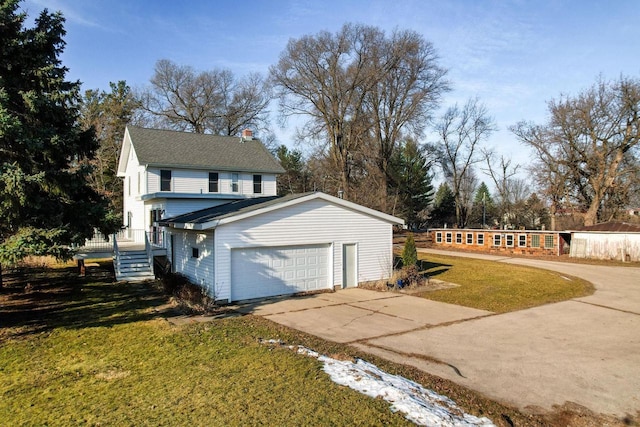 view of property exterior featuring a lawn