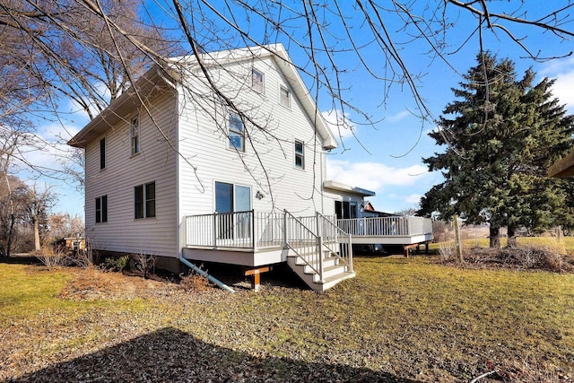 view of property exterior with a lawn and a wooden deck