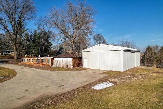 view of outdoor structure featuring a lawn