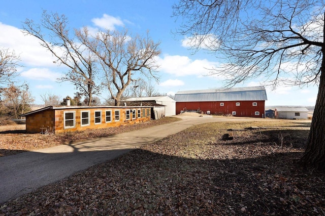 back of property with an outbuilding