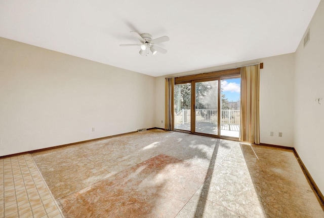 tiled empty room with ceiling fan