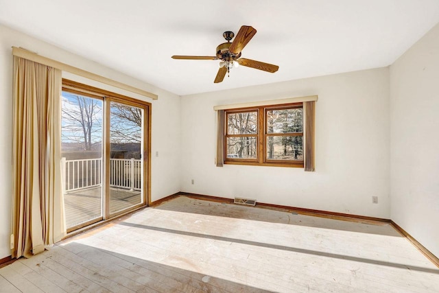 unfurnished room featuring ceiling fan and light hardwood / wood-style flooring