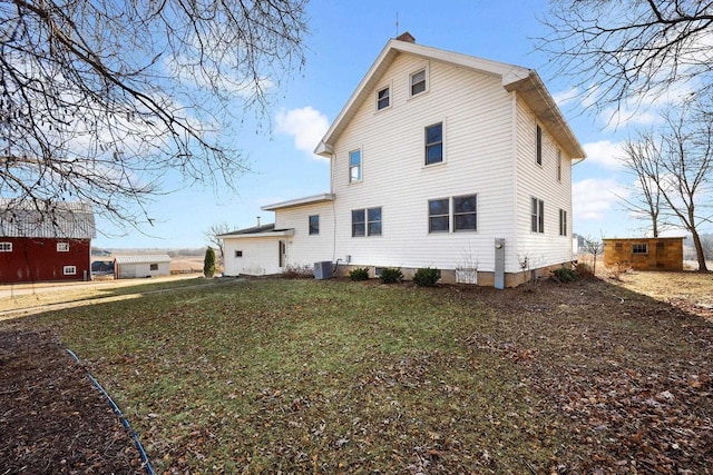 rear view of property featuring central air condition unit