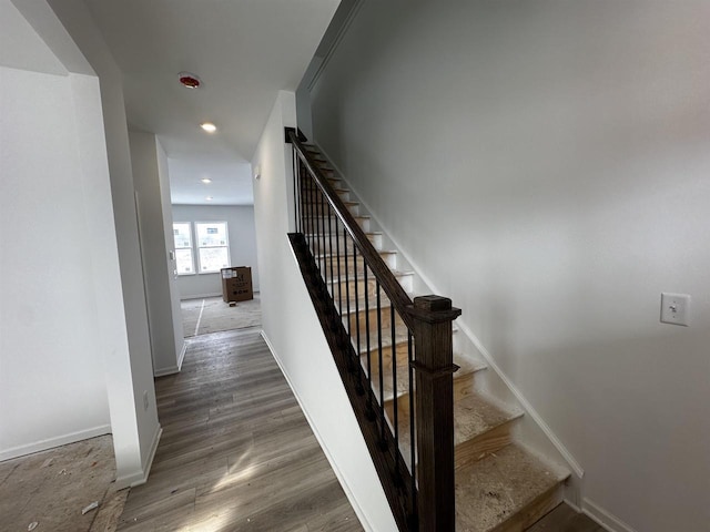 staircase featuring hardwood / wood-style floors